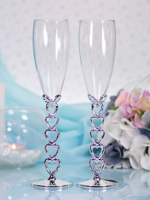 Свадебные бокалы для шампанского, ножка сердечками Свадебные бокалы для шампанского из мельхиора, ножка бокала состоит из 5 сердечек. 