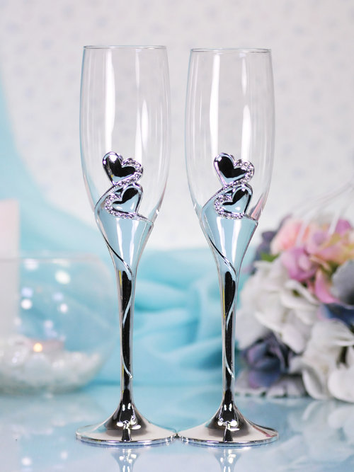 Свадебные бокалы для шампанского Царица Свадебные бокалы для шампанского из мельхиора, основание бокала украшено двумя сердцами 